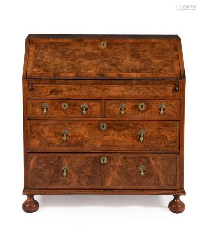 A George II walnut and feather banded bureau