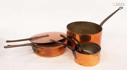 Five copper pans, the largest 29cm diameter and two lids,