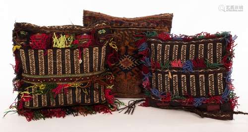 Three vintage Afghan saddlebag cushions with needlework deco...