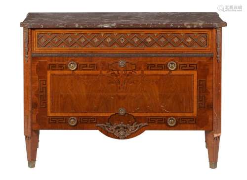 A mahogany and inlaid commode in French late 18th century ta...