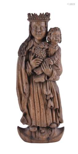 A Continental well carved oak group of Madonna and child