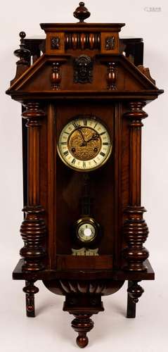 A Vienna type wall clock in a walnut case, fitted an eight-d...