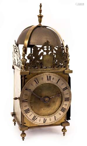 An English lantern clock with pin and hoop support,