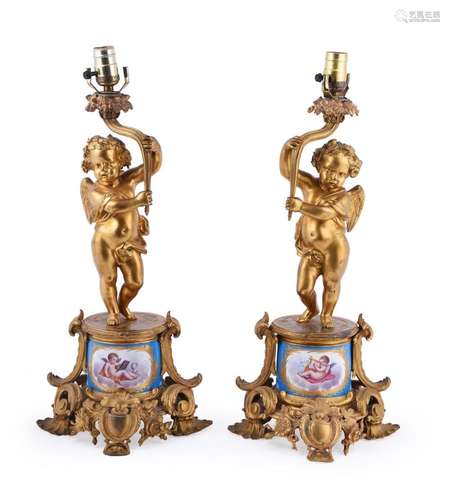 A pair of gilt metal and Sevres style porcelain mounted tabl...