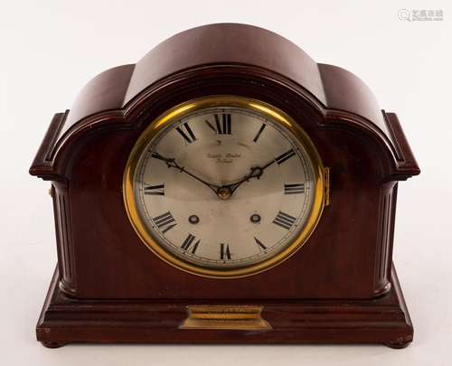 An Edwardian mahogany eight-day mantel clock in an arch top ...