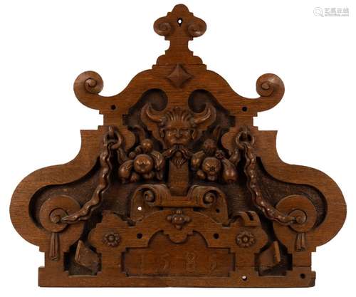 An Elizabeth I style carved oak pediment with a central horn...