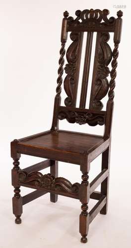 An early 18th Century English high-backed carved oak side ch...