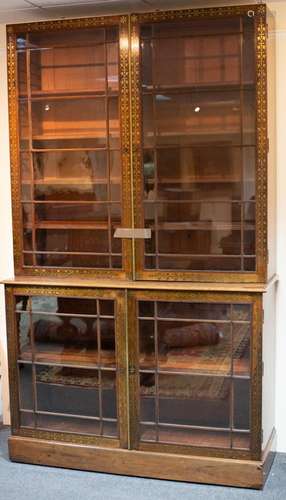 An early Victorian rosewood and brass inlaid bookcase, the c...