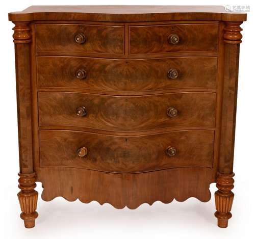 A Victorian satin mahogany chest of serpentine outline,