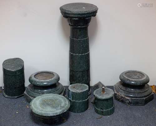 A pair of Italian green mottled marble pillars, the reeded c...