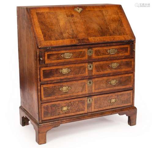 A George I walnut and feather banded and crossbanded bureau,