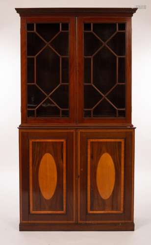 An Edwardian mahogany bookcase, the two glazed doors below i...