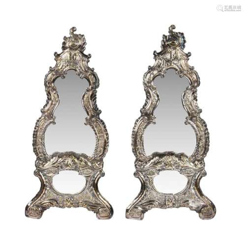 A pair of silver plated brass wall mirrors in Rococo style
