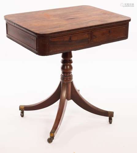 A Regency rosewood lamp table, with rounded top and two draw...