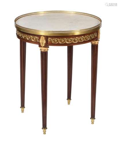 A French mahogany and gilt metal mounted gueridon table in L...