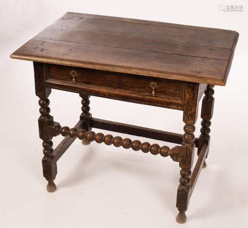 A William and Mary oak side table, the planked top above a s...