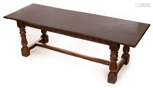 An oak three-plank refectory table, the top supported on a H...