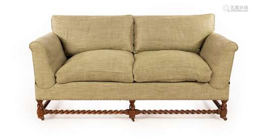 A Howard & Sons Victorian two-seat sofa, the drop ends w...