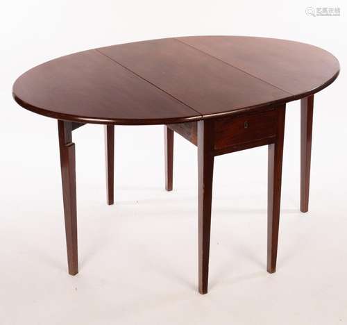 A George III mahogany oval two-flap table on square taper le...