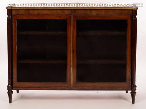 A Regency mahogany side cabinet with a brass galleried top a...