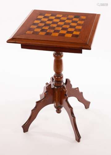 A Victorian mahogany tripod table, inlaid for chess on a tur...