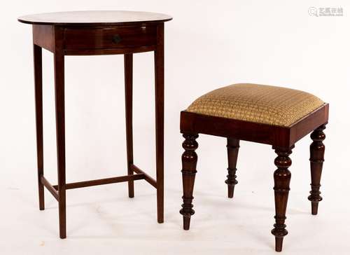 An oval mahogany side table, fitted a drawer, on square tape...