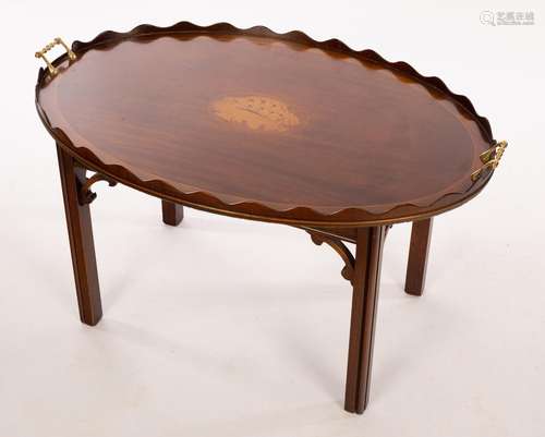 A tray top coffee table, the oval top with a galleried borde...