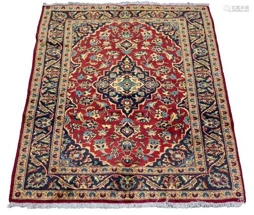 A Kashan rug,