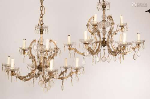 A pair of glass nine-light chandeliers with three upper ligh...