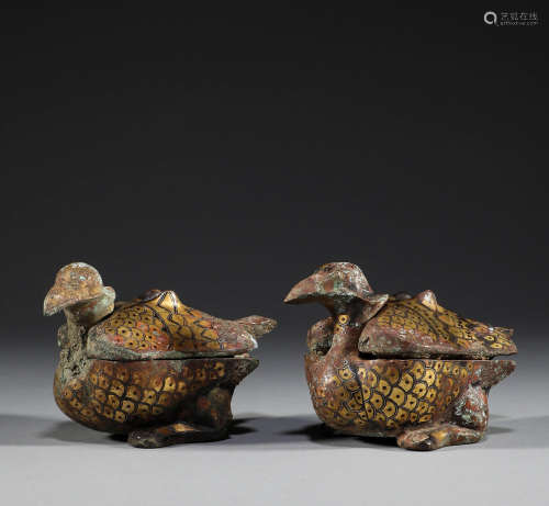 In ancient China, a pair of bronze inlaid bird and beast box...