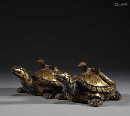 In ancient China, a pair of bronze inlaid gold basaltic pape...