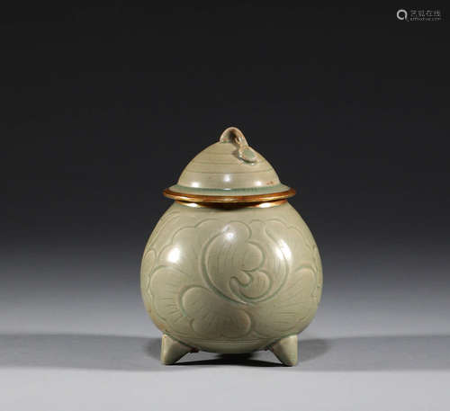 In ancient China, celadon covered gold mouth tripod pot