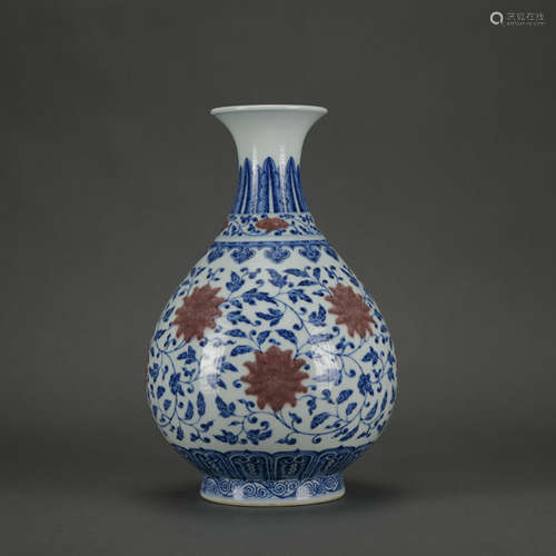 An underglaze-blue and copper-red 'floral' pear-shaped vase,...