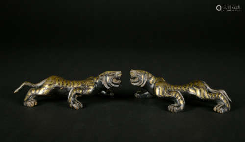 A pair of bronze beast ware with gold and silver