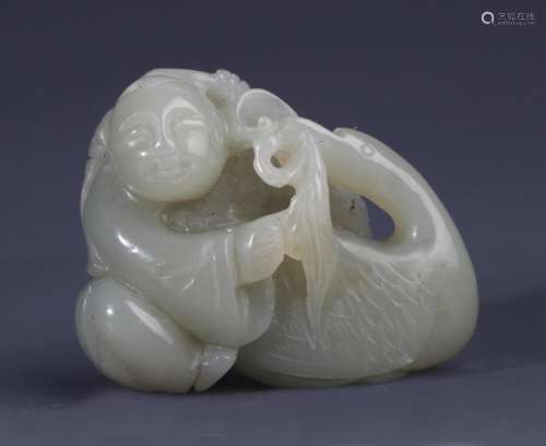 A FINELY CARVED BOY WITH GOOSE PALE CELADON JADE