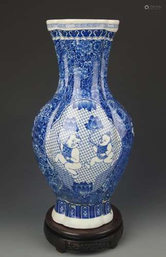 A LARGE BLUE AND WHITE BOY PAINTED VASE