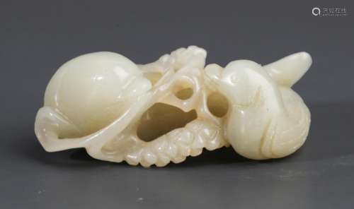 A FINELY CARVED WHITE JADE PENDANT IN FIGURE OF "RU YI&...