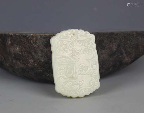 A FINELY CARVED HETIAN PALE CELADON JADE PENDANT