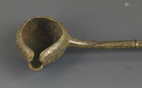 A LONG HANDLE BRONZE SPOON