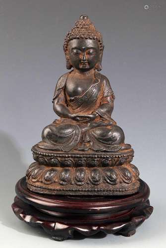 A FINELY CARVED IRON MADE AKSHOBHYA BUDDHA