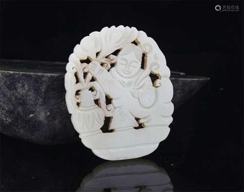 A FINE BOY WITH LOTUS CARVING PALE CELADON JADE PENDANT