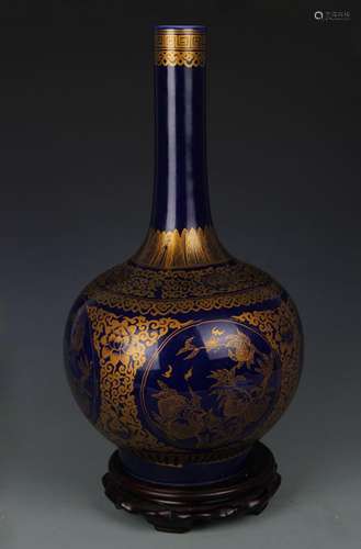 A BLUE GROUND GILT LONG NECK VASE