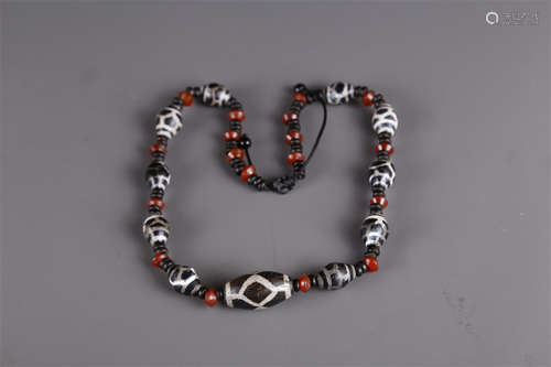 A Necklace of Dzi Beads.