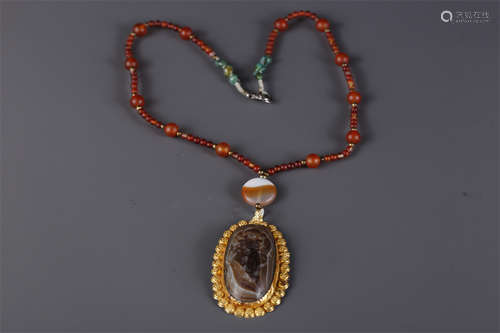 A Necklace of Agate Bead, with Golden Rim.