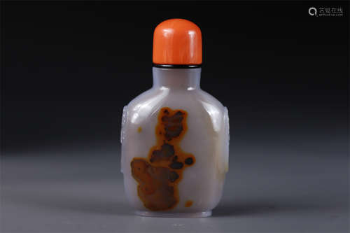 An Agate Snuff Bottle with Beast Face Design.