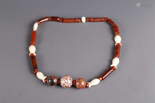 A Necklace of Agate Beads.