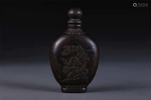 An Agarwood Snuff Bottle with Flowers Design.