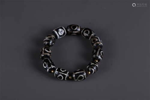 A Bracelet of Dzi Beads.