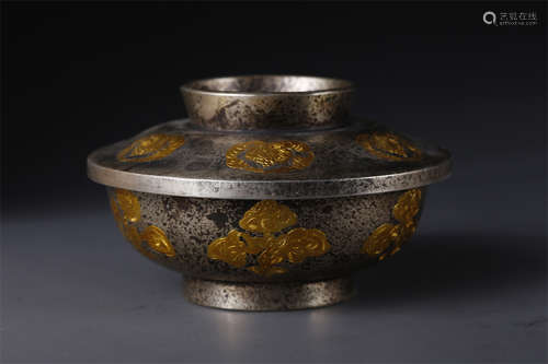 A Copper Lidded Bowl with Flowers Design.