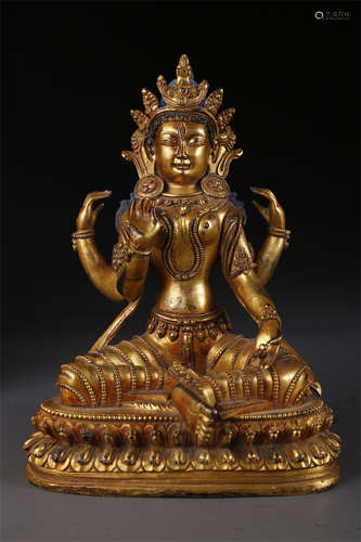 A Gilt Copper Four-Arm Female Buddha Statue.